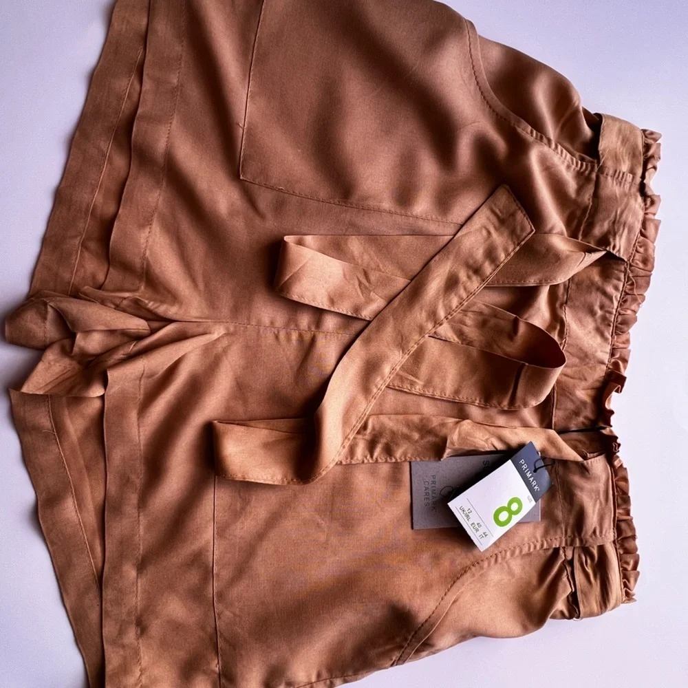 Dress shorts, yellow size 8 . PRIMARK CARES